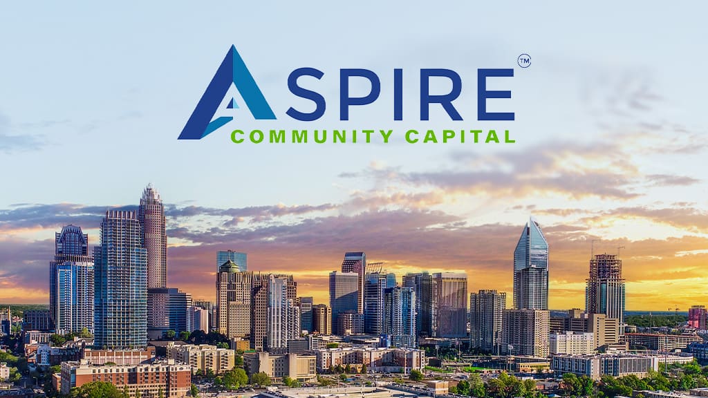 Aspire Community Capital logo above Charlotte, NC skyline